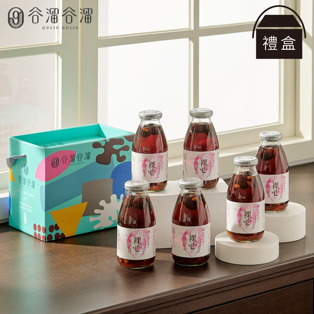 谷溜谷溜裸心桂圓紅棗禮盒，六入裝，擺放於窗邊桌上。